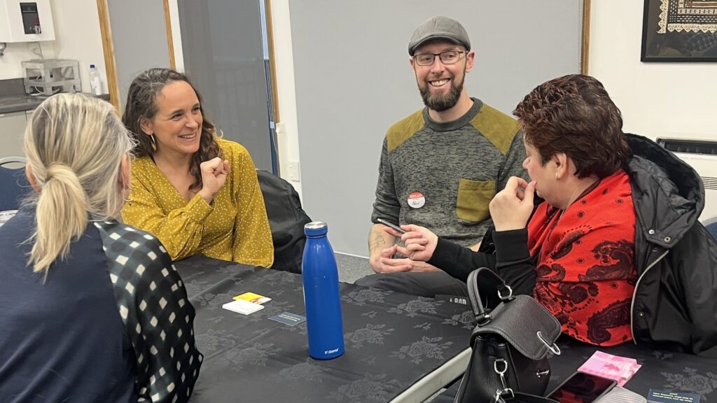 decision makers discussing and laughing at Talk Business